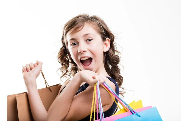 Gelukkig meisje winkelen met zakken — Stockfoto