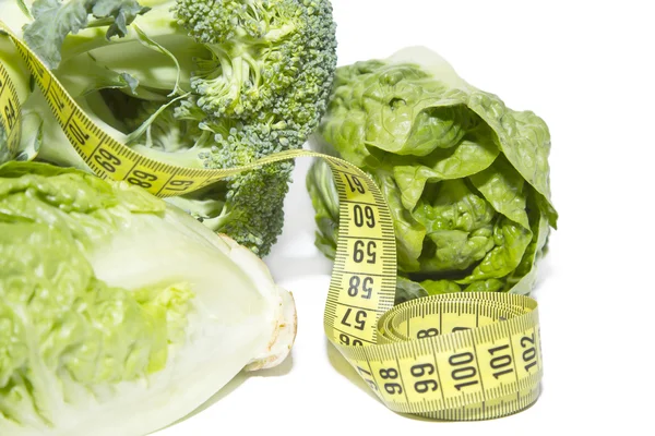 Broccoli and lettuce hearts with tape — Stock Photo, Image