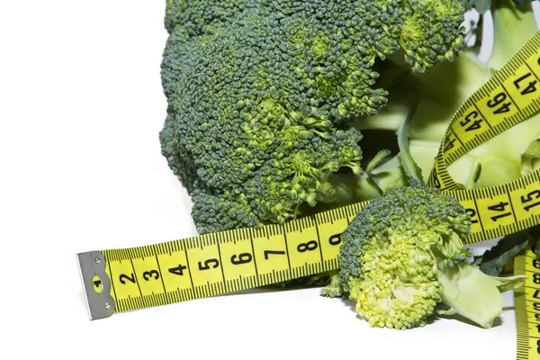 Broccoli and tape measure isolated — Stock Photo, Image