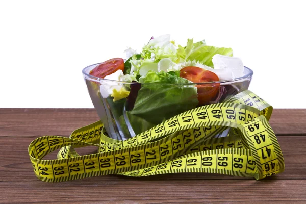 Salad and tape measure — Stock Photo, Image