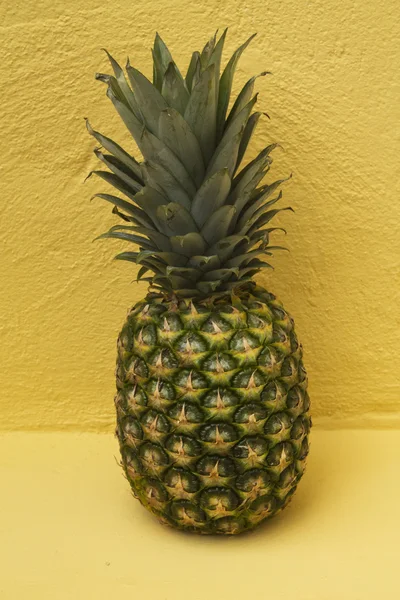 Fruit, pineapple over yellow background — Stock Photo, Image