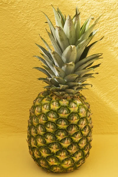 Fruit, pineapple over yellow background — Stock Photo, Image