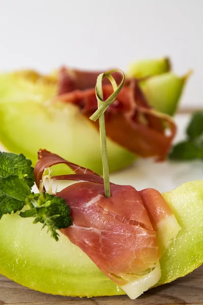 Concept of spanish food with melon and prosciutt — Stock Photo, Image