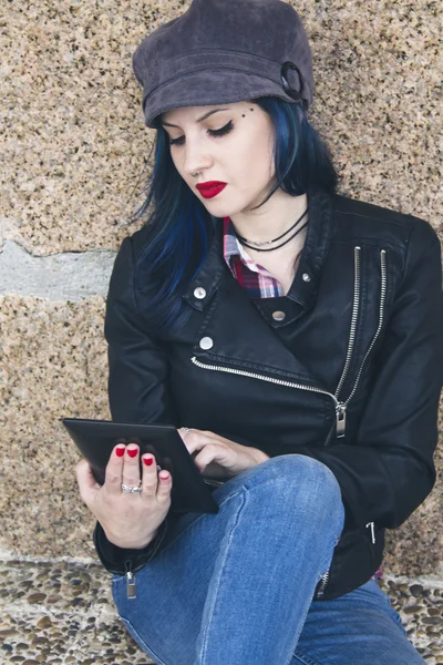 Young woman with the tablet on the street — Stock Photo, Image