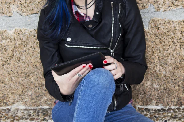 Young woman with the tablet on the street — Stock Photo, Image