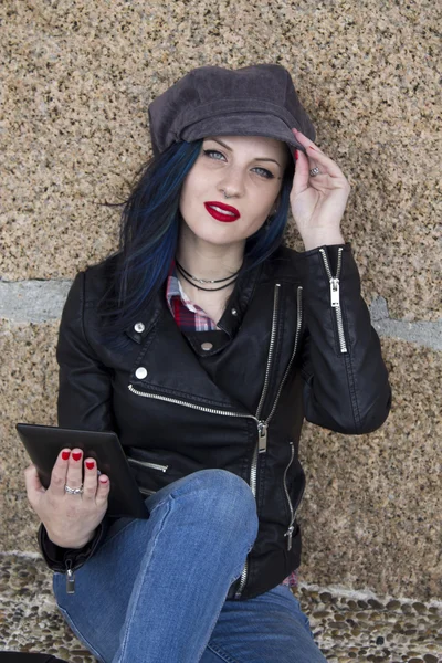 Young woman with the tablet on the street — Stock Photo, Image