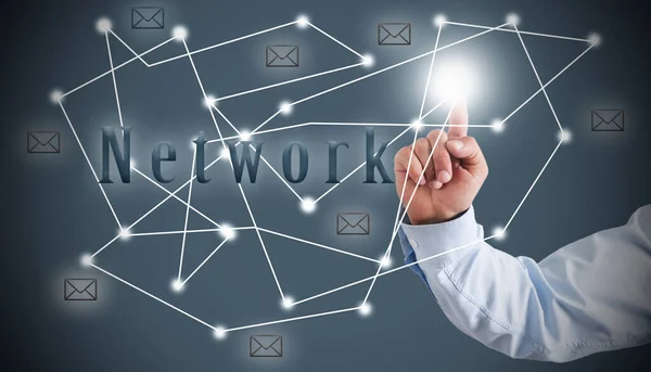 Businessman presses with finger on the structure of the network. network concept