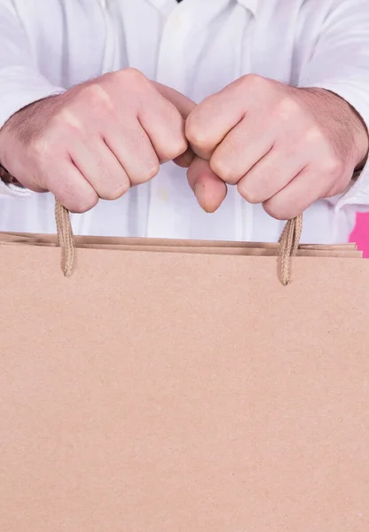 man holding cardboard bags for shopping