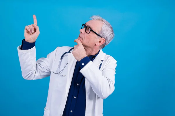 doctor raising finger and pointing, thinking of an idea