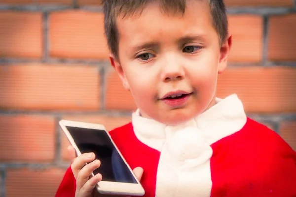 Χαρούμενο Χαμογελαστό Παιδί Χριστούγεννα Κόκκινο Κοστούμι Santa Claus Κινητό Τηλέφωνο — Φωτογραφία Αρχείου