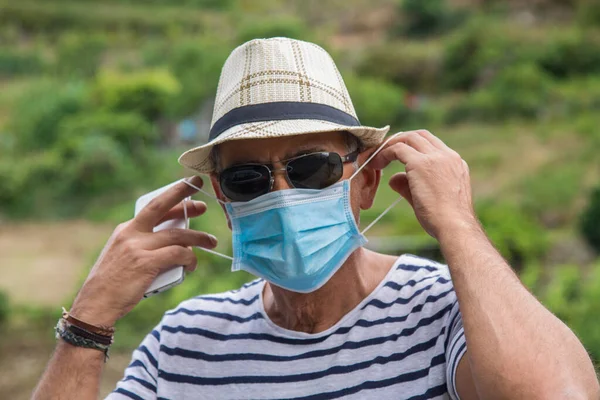 man with medical mask using medical phone