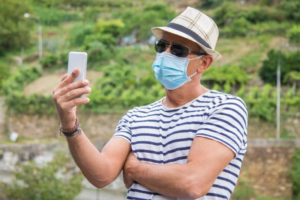 man with medical mask using medical phone