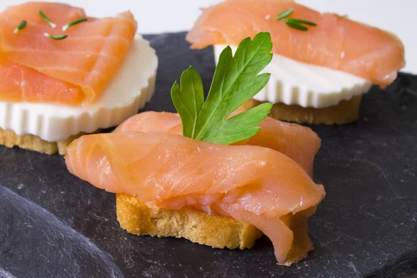 Delicious salmon canapes — Stock Photo, Image