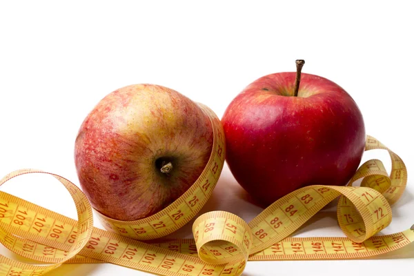 Fruit met een meetlint geïsoleerd — Stockfoto