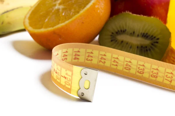 Fruits et ruban à mesurer avec fond — Photo