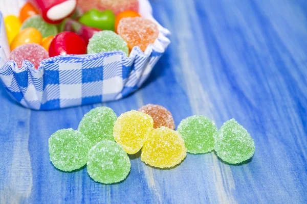 Jelly beans on blue background — Stock Photo, Image