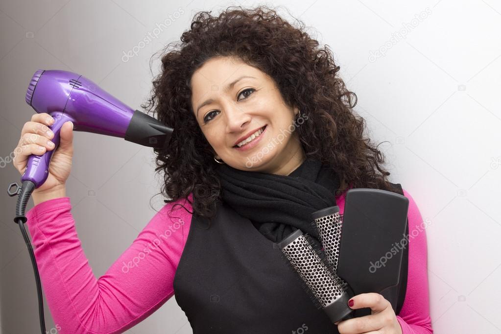 Hairdresser with hair dryer