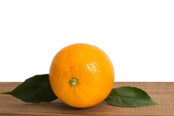 Basket of oranges on wooden board — Stock Photo, Image