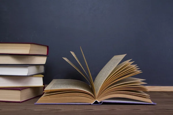 Blackboard and books — Stock Photo, Image