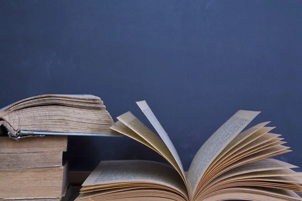 Blackboard and books — Stock Photo, Image