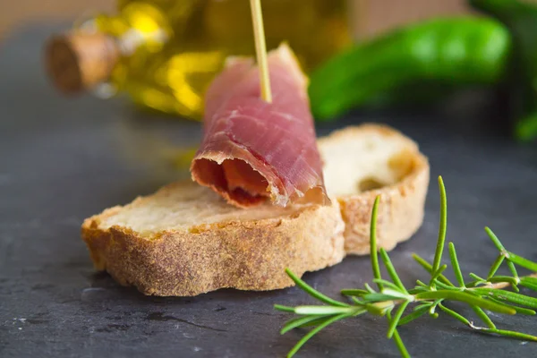 Serrano ham with rosemary — Stock Photo, Image