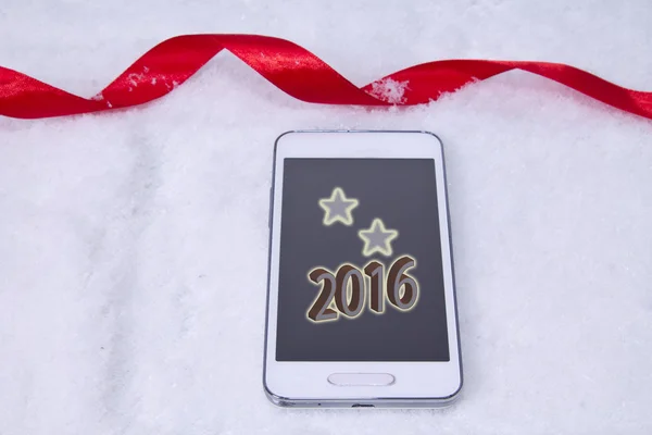 Мобильный со звездой на снегу — стоковое фото