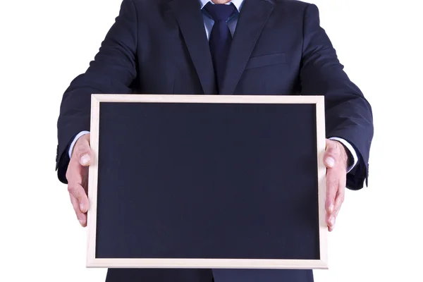 Businessman holding blackboard with hands — Stock Photo, Image