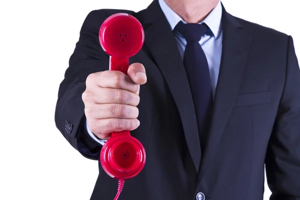 Businessman with red phone Royalty Free Stock Photos