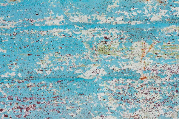 peeling paint on metal close-up with copy space. Rough texture with peeling paint.