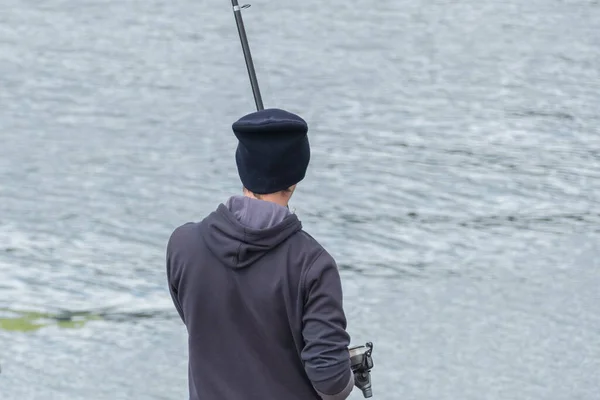 Young Man Prepares Fishing Rod Dock — Stock Photo, Image