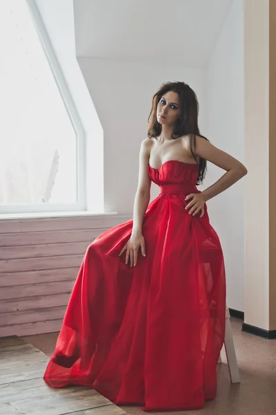 Portrait of a girl in a long red evening dress 6023. — Stock Photo, Image