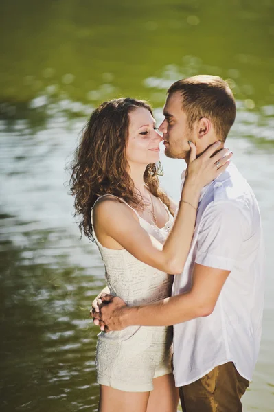 Embrace on a background of greenish water of the pond 6317. — Stock Photo, Image