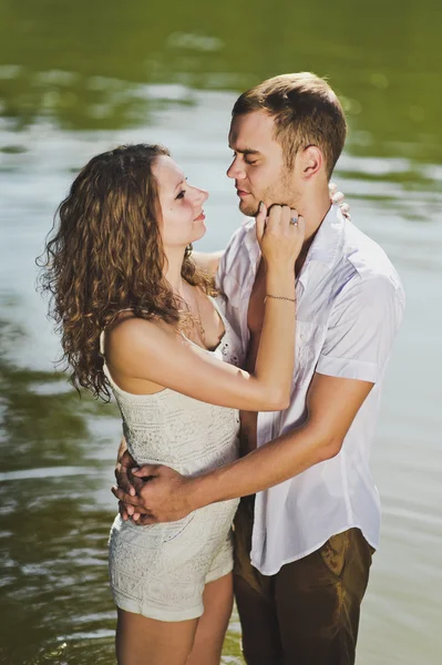 Embrace on a background of greenish water of the pond 6319. — Stock Photo, Image