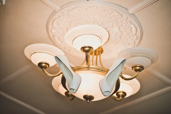 Shoes on a chandelier 924. — Stock Photo, Image