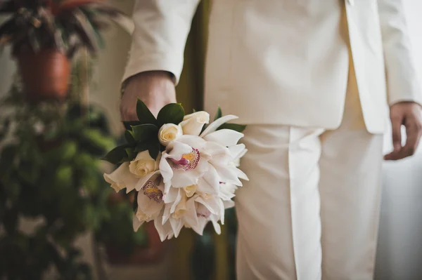 Flowers in hands of the man 1807. — Stock Photo, Image