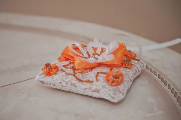 Wedding rings on a pillow for ornaments 1964. — Stock Photo, Image