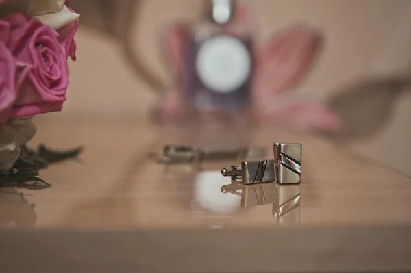 Cuff links on a table 2381. — Stock Photo, Image