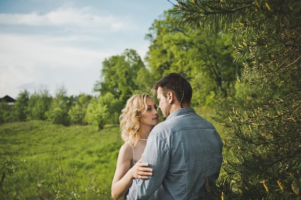 Newly-married couple in the wood about a tree 3194. — Stock Photo, Image