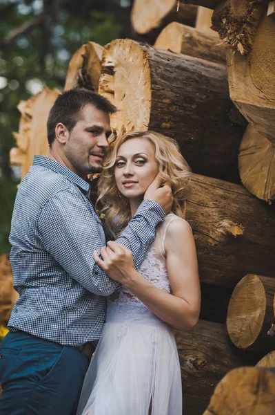 Walk of a newly-married couple about logs 3243. — Stock Photo, Image