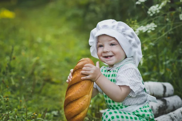 Child holding a loaf of bread 4702. — Stock Photo, Image