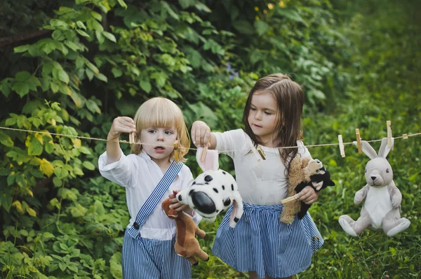 Girl and boy toys are hung after washing 4730. — Stock Photo, Image