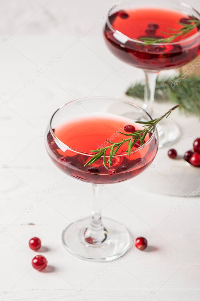 Winter drink cocktail cranberry rosemary white background.
