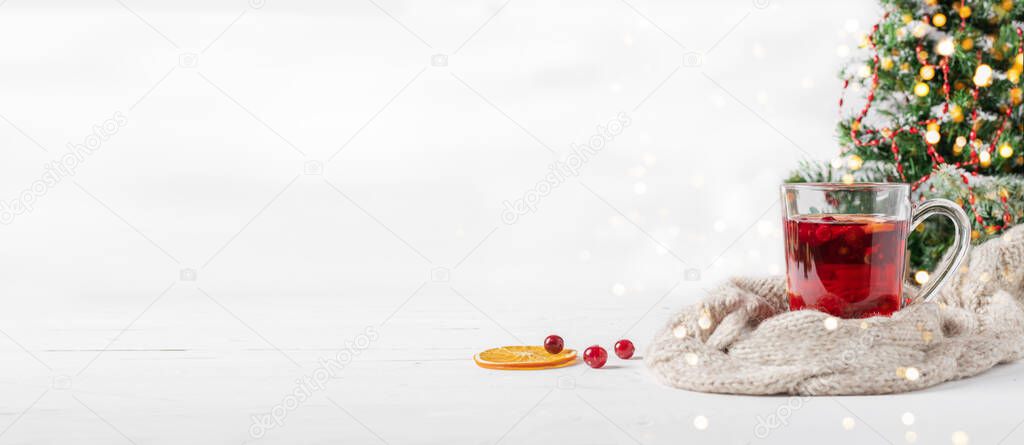 Winter drink cocktail mulled wine orange cranberries glasses white background.