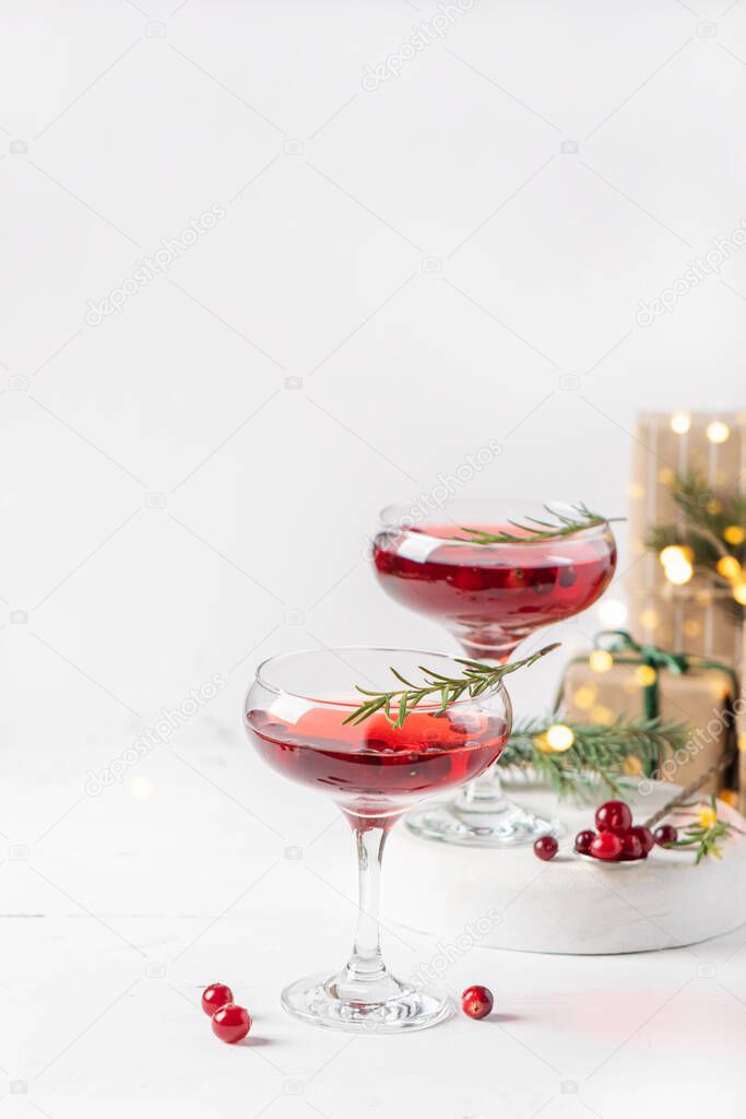 Winter drink cocktail cranberry rosemary white background.