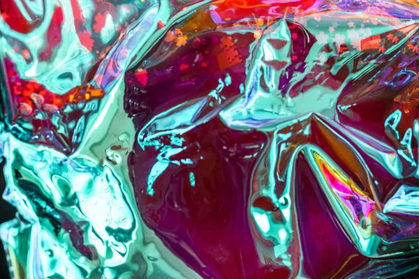 Fondo abstracto rojo brillante holograma arrugado con destellos. Fondo texturizado de neón de moda —  Fotos de Stock