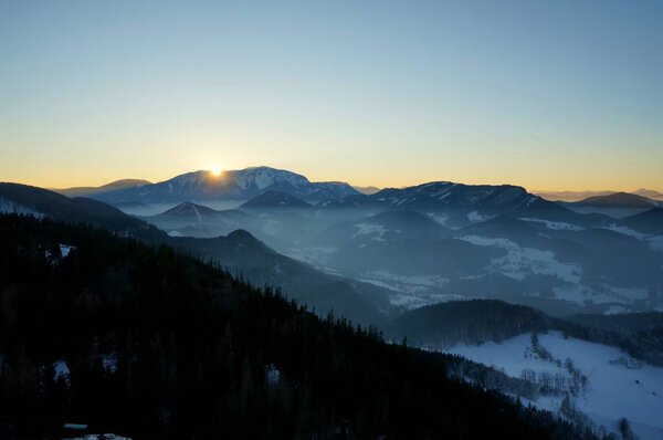 The sun can be seen for the last time: Idyllic sunset in the Mountains / Mount Schneeberg / Hohe Wand