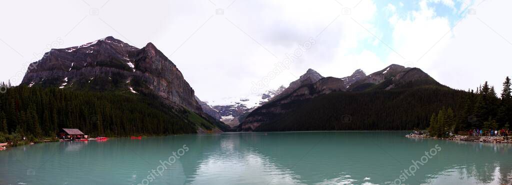 Panoramic view: Turquoise Beautiful Lake in Rocky Mountainsin Banff National Park, Alberta, Canada. Nature and Outdoor Concept.