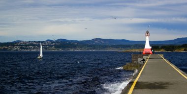 Wild sea at Lighthouse and Breakwater at Ogden Point in Victoria, British Columbia, Canada clipart