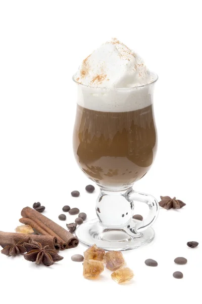 Black coffee with whipped cream in frappe glasses on a white background with cinnamon sticks, spices, coffee beans and caramel sugar. hot drink - latte, cappuccino — Stock Photo, Image