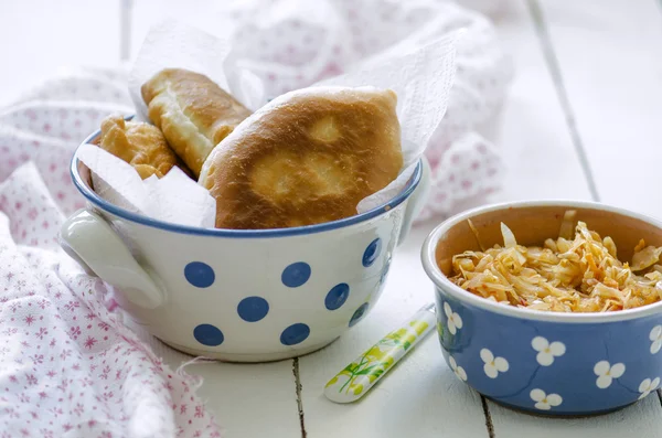 Fried pies with cabbage and stew cabbage — Stock Image Fried pies with cabbage and stew cabbage Royalty Free Stock Photos